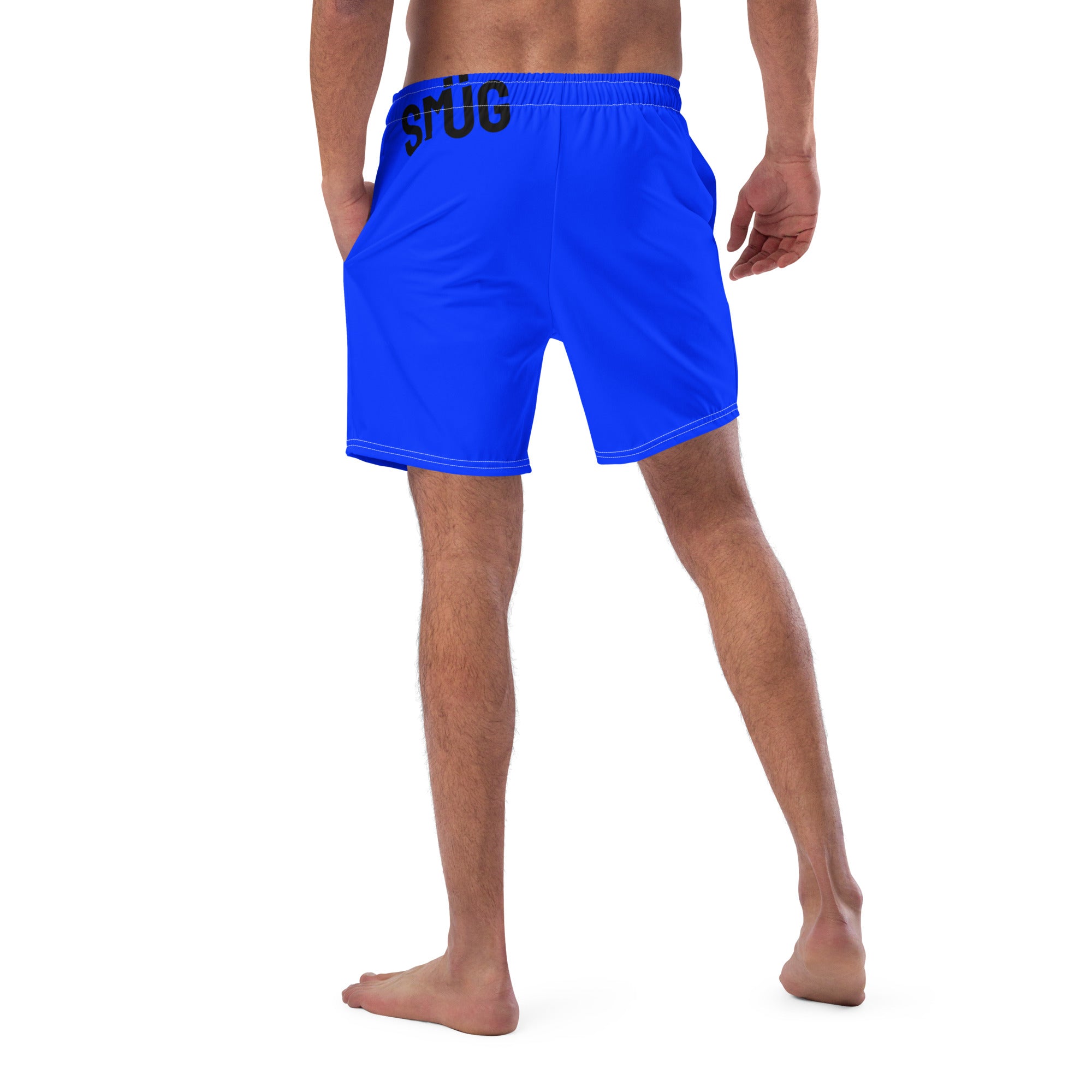 Blue swim shorts with 'SMÜG' branding on a white background